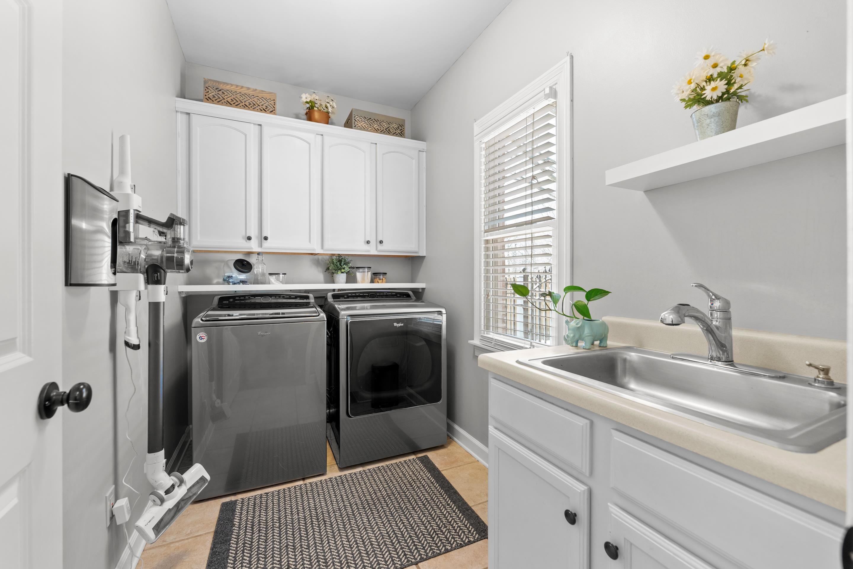 1339 Winoka Road Collierville, TN 38017 - Photo 20 of 40 a kitchen with a sink cabinets and stainless steel appliances