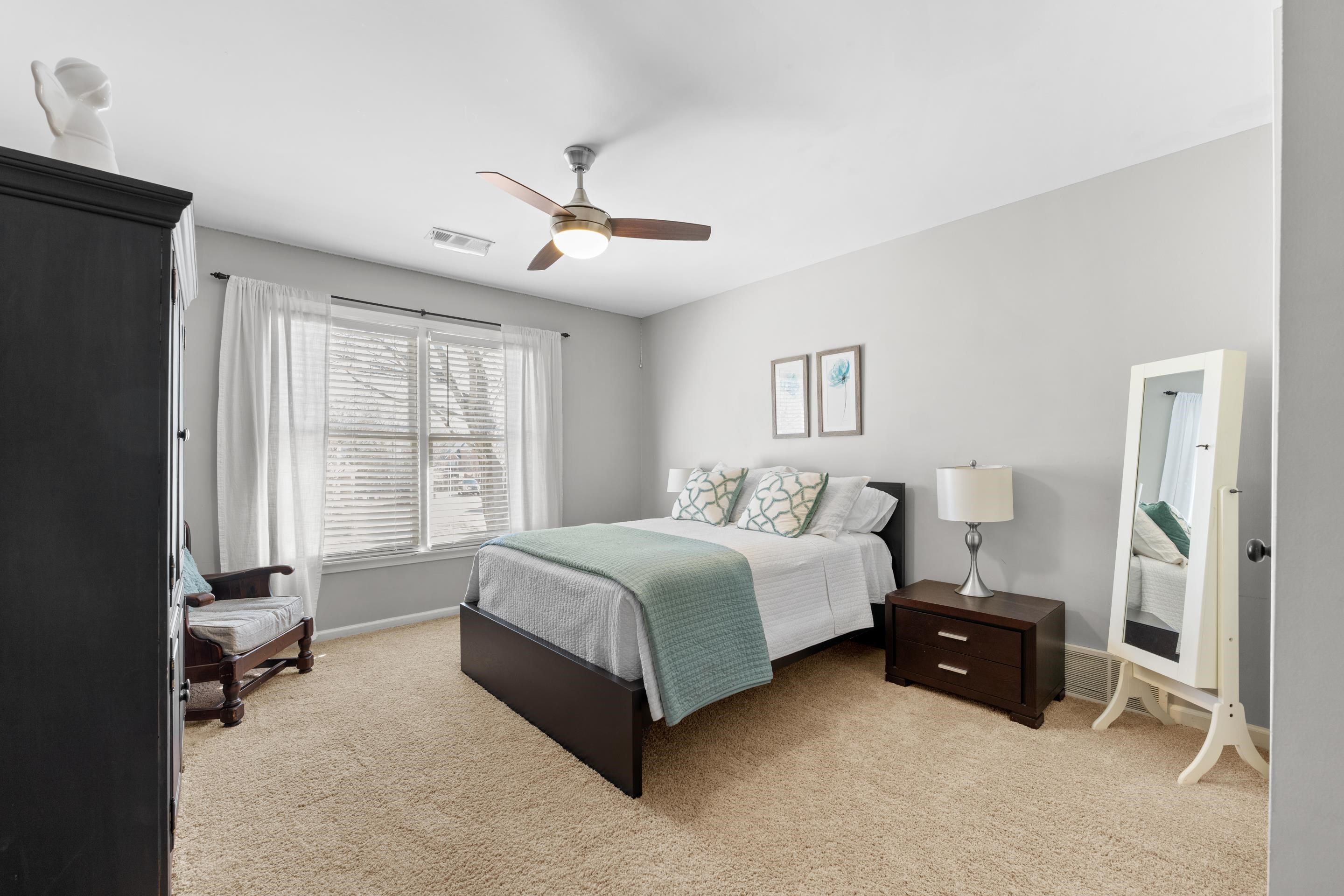1339 Winoka Road Collierville, TN 38017 - Photo 33 of 40 a spacious bedroom with a bed and a window