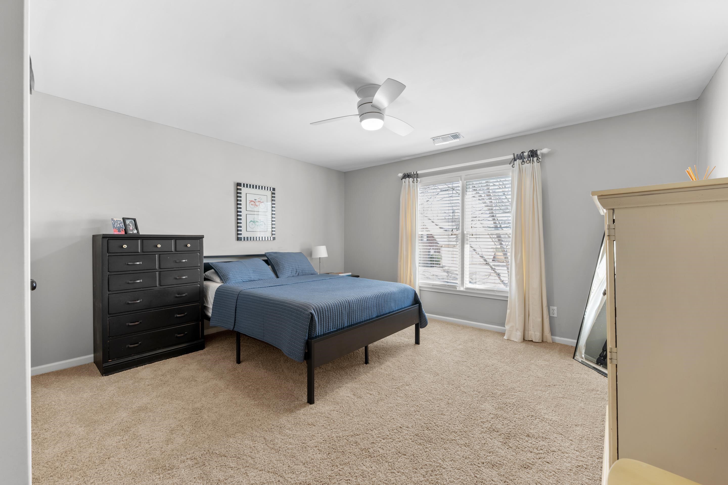 1339 Winoka Road Collierville, TN 38017 - Photo 34 of 40 a spacious bedroom with a bed and a window