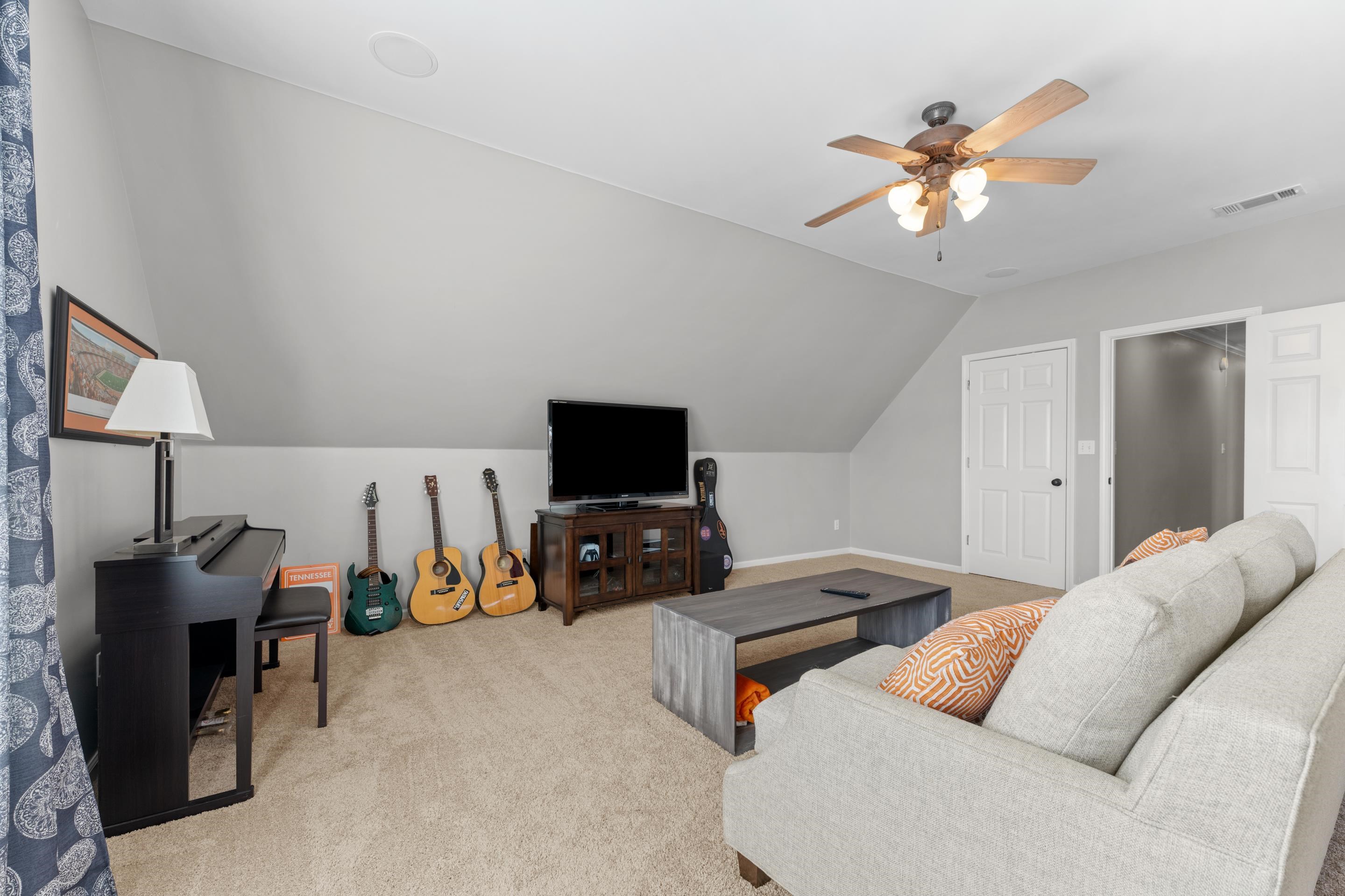 1339 Winoka Road Collierville, TN 38017 - Photo 37 of 40 a bedroom with furniture and a flat screen tv