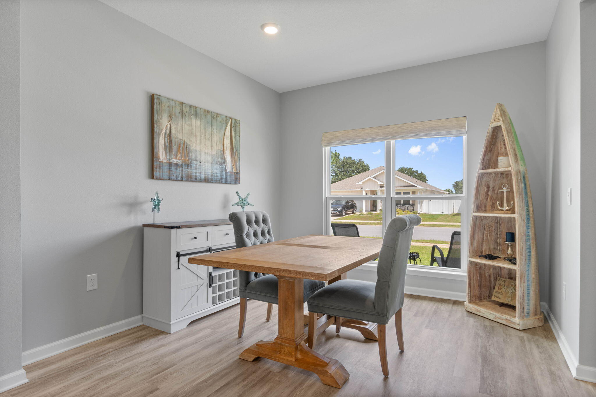38 Silverthorn Street Freeport, FL 32439 - Photo 14 of 42 a view of a dining room with furniture window and wooden floor