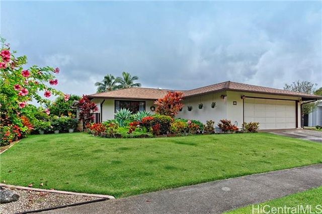 a view of a house with a garden