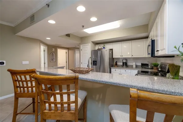 a bathroom with a tub and a view of bathroom