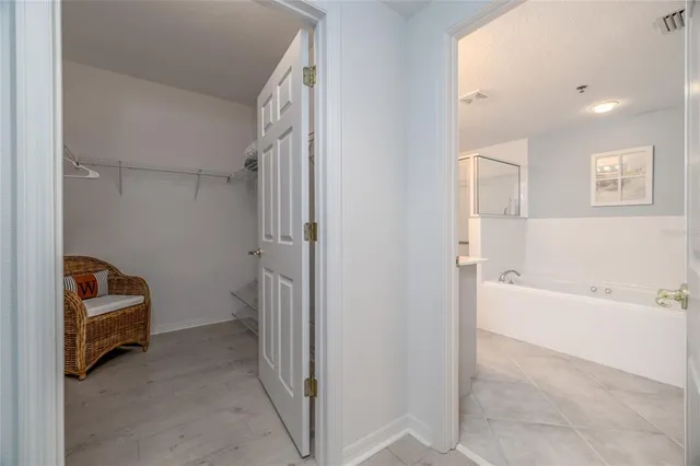 a bathroom with a granite countertop sink a mirror and a shower