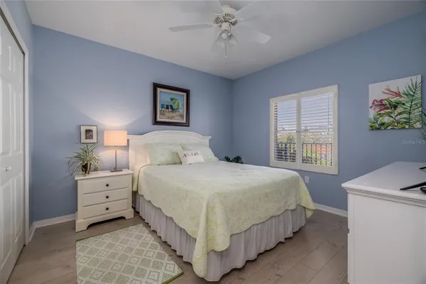 a view of a hallway with a livingroom and a bathroom