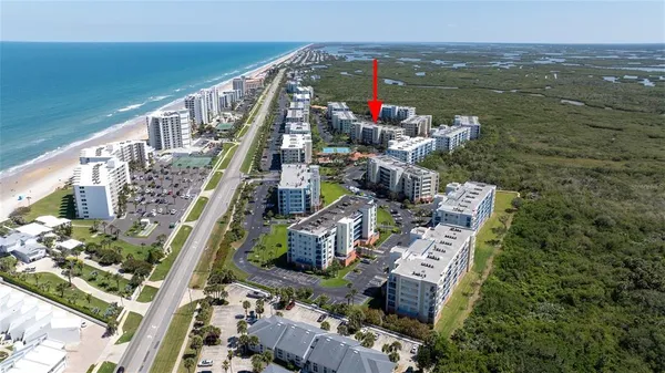 a kitchen with stainless steel appliances granite countertop a refrigerator sink and stove