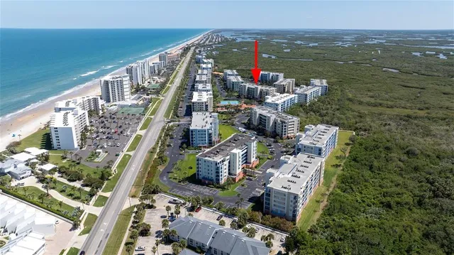 a kitchen with stainless steel appliances granite countertop a refrigerator sink and stove