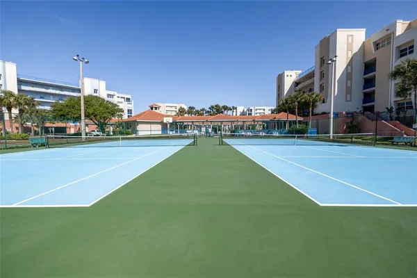 a view of backyard with swimming pool and green space