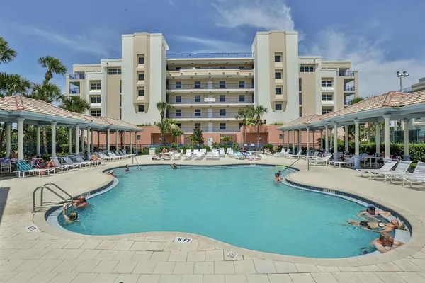 a view of yard with swimming pool and green space