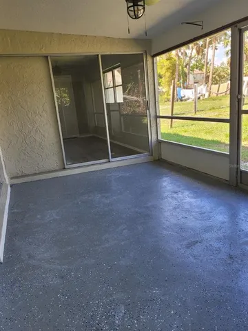 an empty room with large window