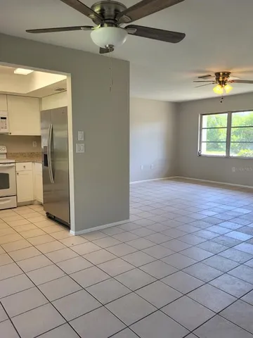 a view of a kitchen with a dishwasher and a refrigerator
