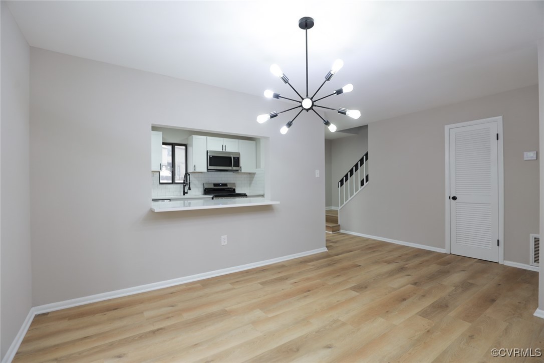 11800 North Briar Patch Drive Midlothian, VA 23113 - Photo 17 of 34 a view of a kitchen with a sink cabinets and wooden floor