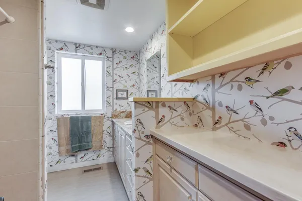 a bathroom with a sink and a mirror