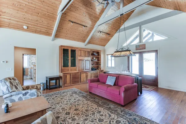 a living room with furniture and a rug