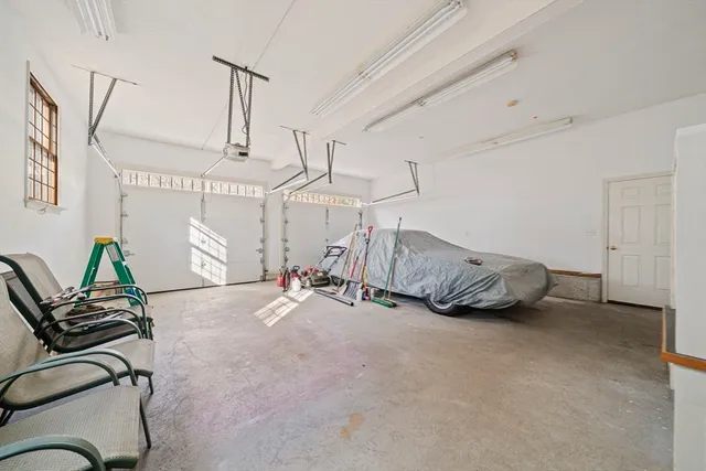a view of a livingroom with furniture and a ceiling fan