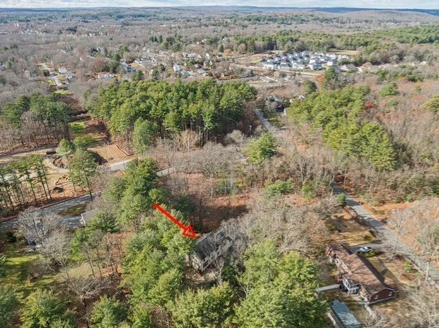 an aerial view of residential house with outdoor space