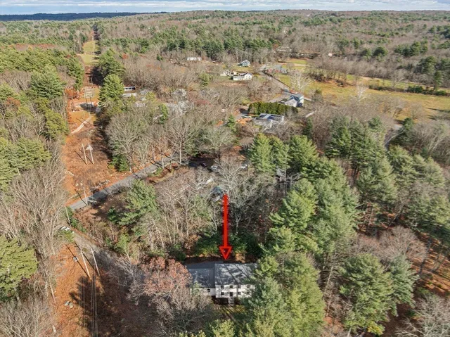an aerial view of residential houses with outdoor space