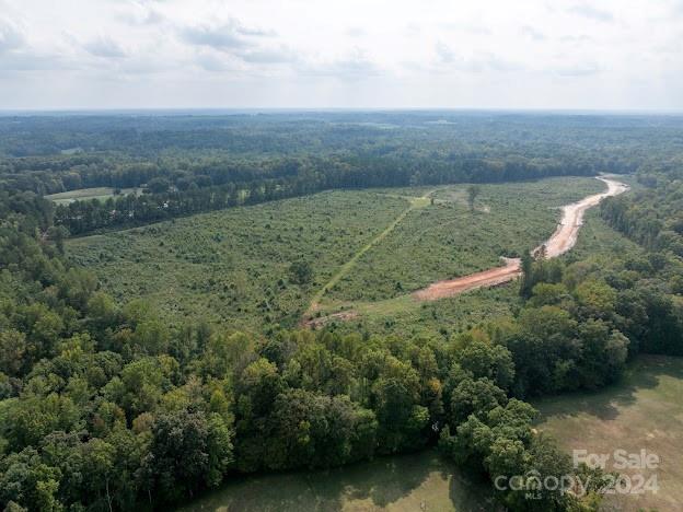 0 South Potter Road, Unit 3 Waxhaw, NC 28173 - Photo 4 of 13 a view of a field with an ocean and trees