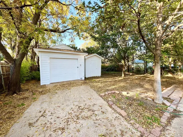 a view of a porch with a table and chairs