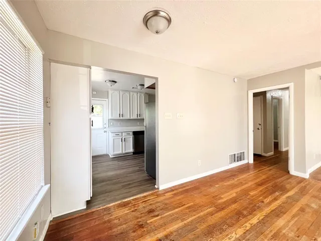 a view of a kitchen from the hallway