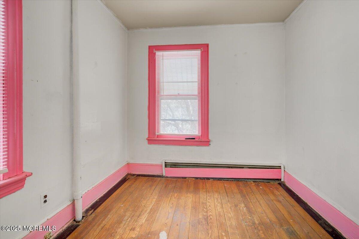 427 Howe Avenue Passaic, NJ 07055 - Photo 19 of 24 a view of a room with wooden floor and window