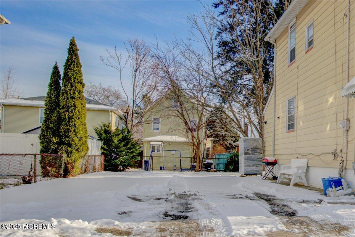 427 Howe Avenue Passaic, NJ 07055 - Photo 24 of 24 a view of a white house with a tree