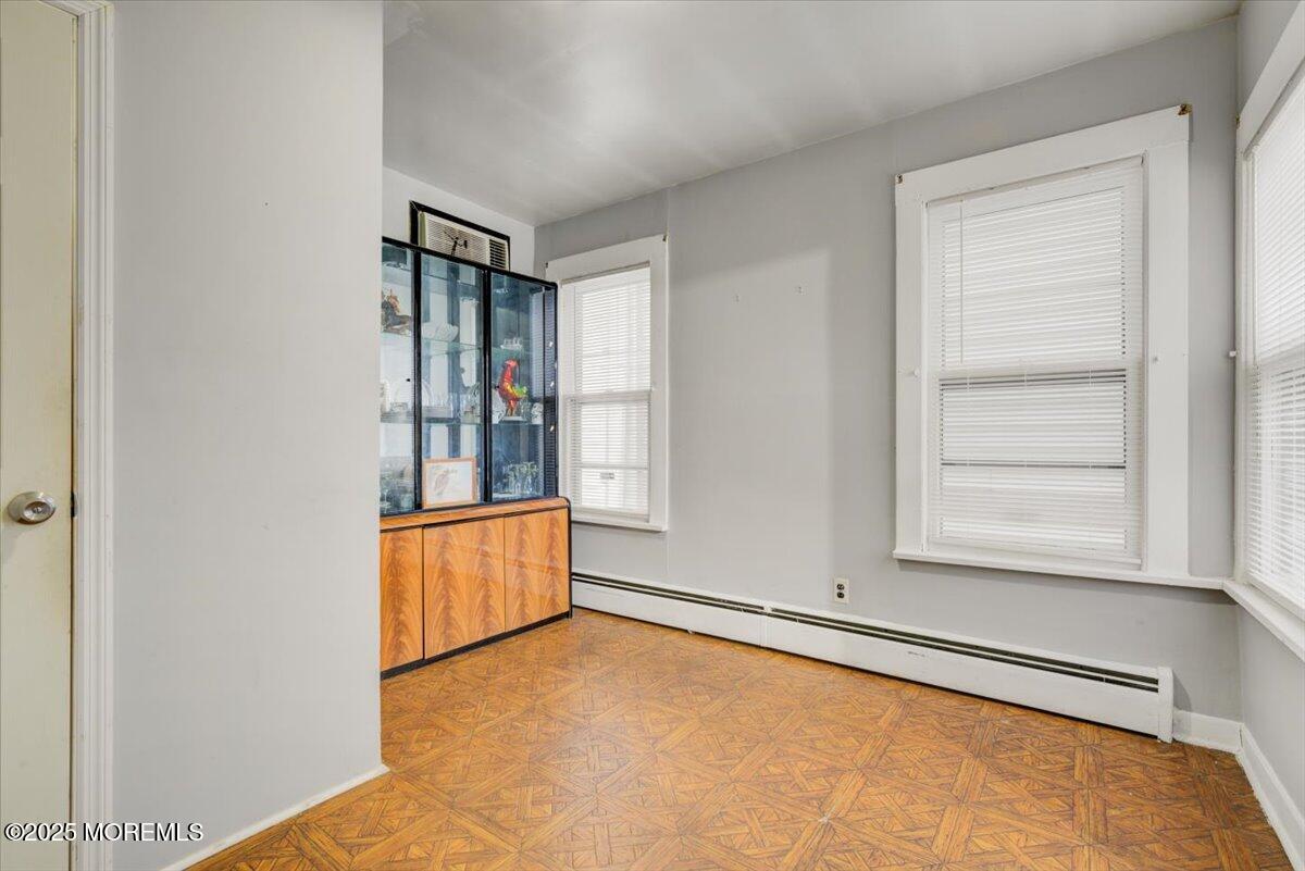 427 Howe Avenue Passaic, NJ 07055 - Photo 10 of 24 an empty room with windows