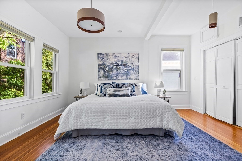 87 Coolidge Street, Unit 2 Brookline, MA 02446 - Photo 12 of 34 a bedroom with a bed and a large window