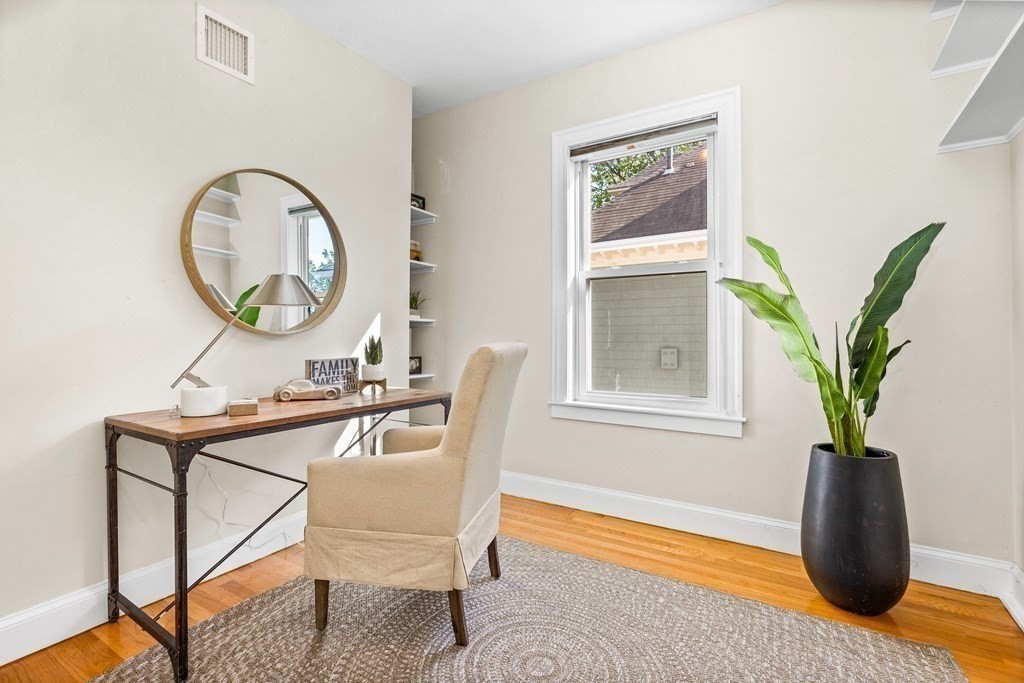 87 Coolidge Street, Unit 2 Brookline, MA 02446 - Photo 14 of 34 a living room filled with furniture and a window