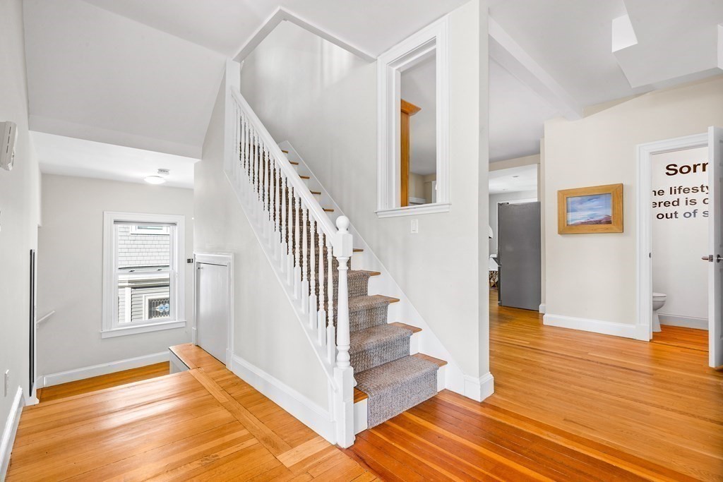 87 Coolidge Street, Unit 2 Brookline, MA 02446 - Photo 15 of 34 a view of entryway and hall with wooden floor