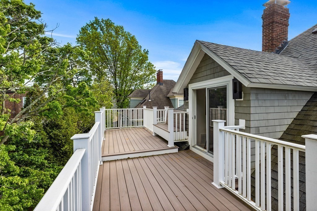 87 Coolidge Street, Unit 2 Brookline, MA 02446 - Photo 19 of 34 a view of deck with chairs and wooden floor