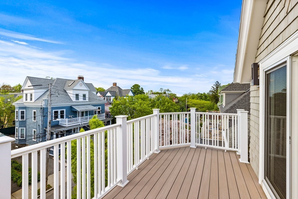 87 Coolidge Street, Unit 2 Brookline, MA 02446 - Photo 24 of 34 a view of a house with wooden deck