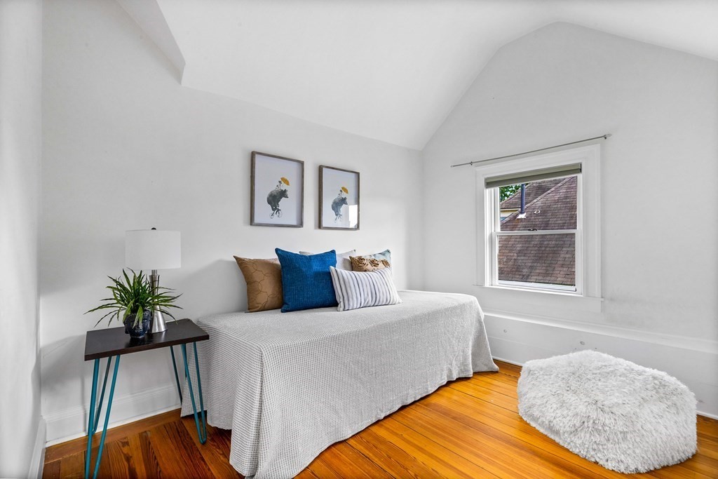 87 Coolidge Street, Unit 2 Brookline, MA 02446 - Photo 26 of 34 a bedroom with a bed and a potted plant