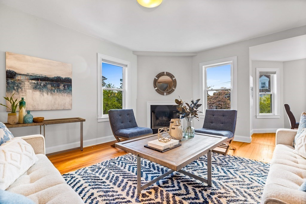 87 Coolidge Street, Unit 2 Brookline, MA 02446 - Photo 5 of 34 a living room with furniture and wooden floor