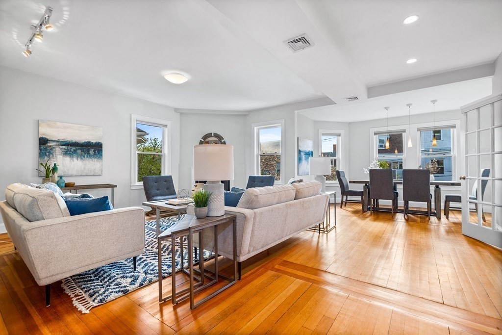 87 Coolidge Street, Unit 2 Brookline, MA 02446 - Photo 6 of 34 a living room with furniture and wooden floor