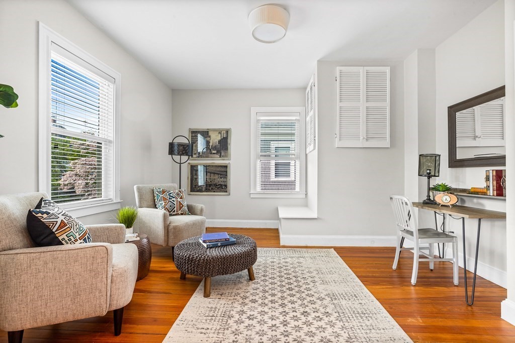 87 Coolidge Street, Unit 2 Brookline, MA 02446 - Photo 9 of 34 a living room with furniture and a table