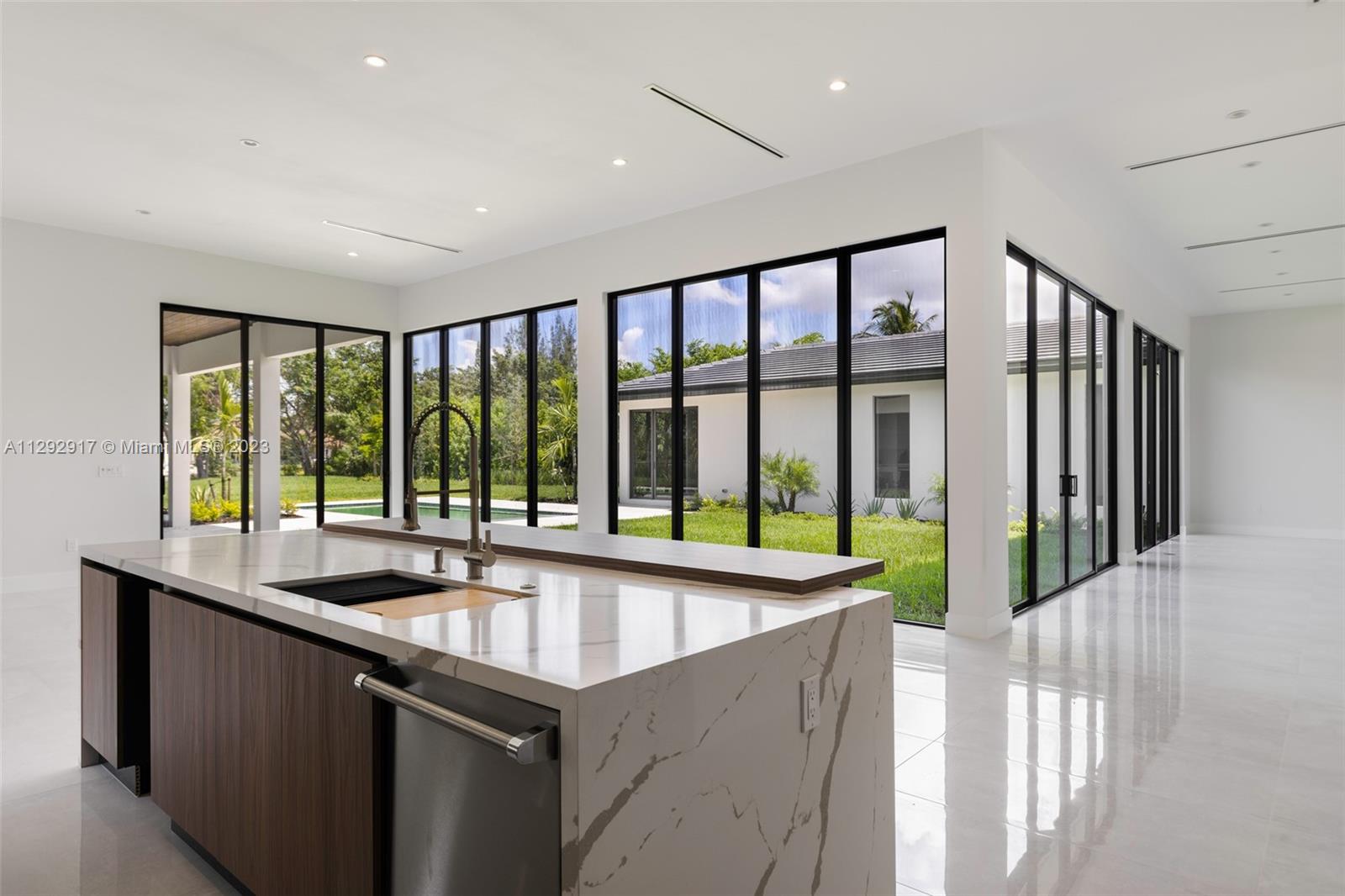 491 Ranch Road Weston, FL 33326 - Photo 13 of 46 a kitchen with a sink and large window