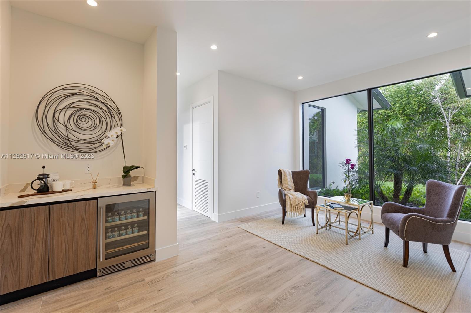 491 Ranch Road Weston, FL 33326 - Photo 19 of 46 a view of a dining room with furniture window and wooden floor