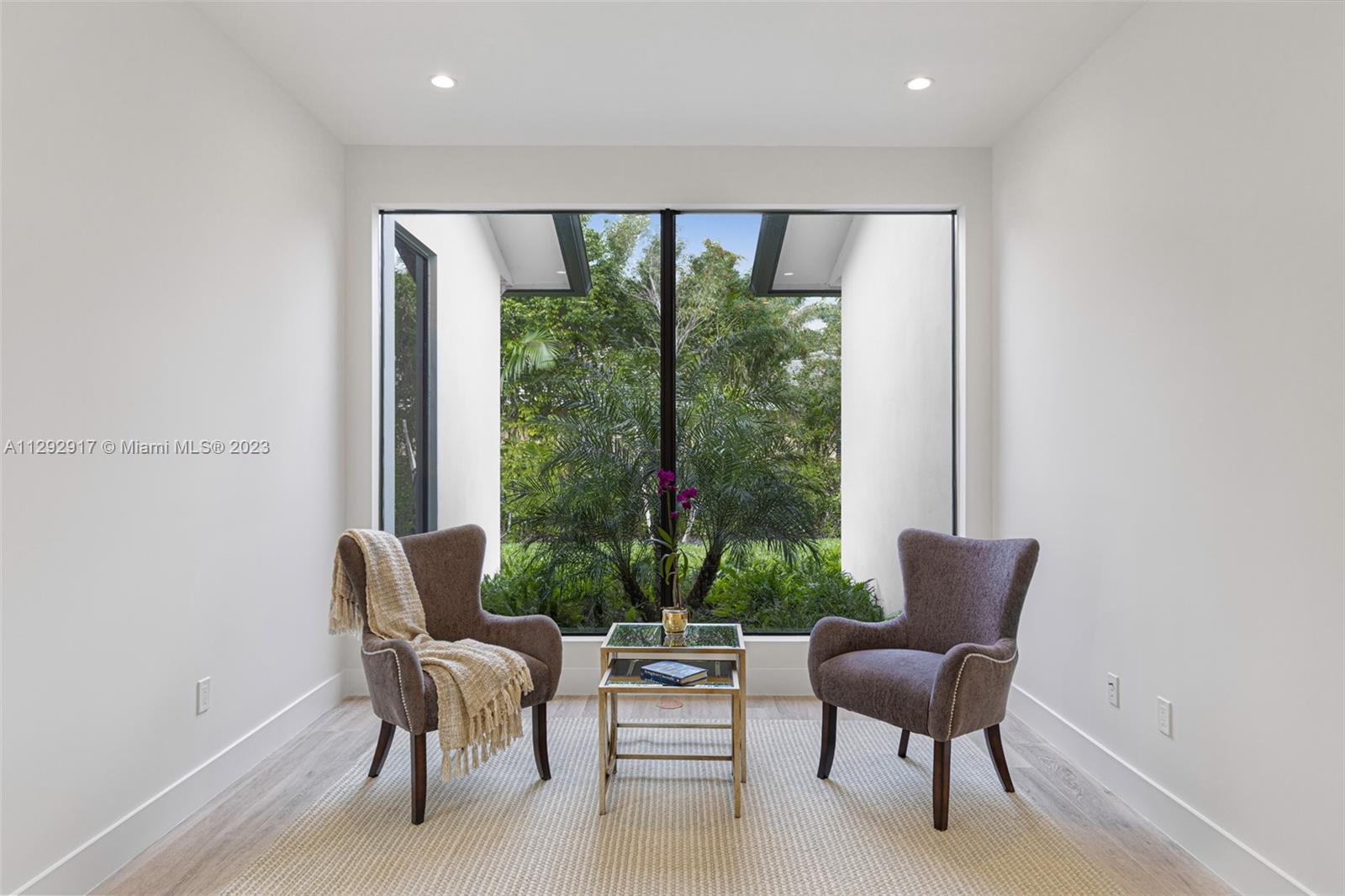 491 Ranch Road Weston, FL 33326 - Photo 20 of 46 a living room with furniture and a large window