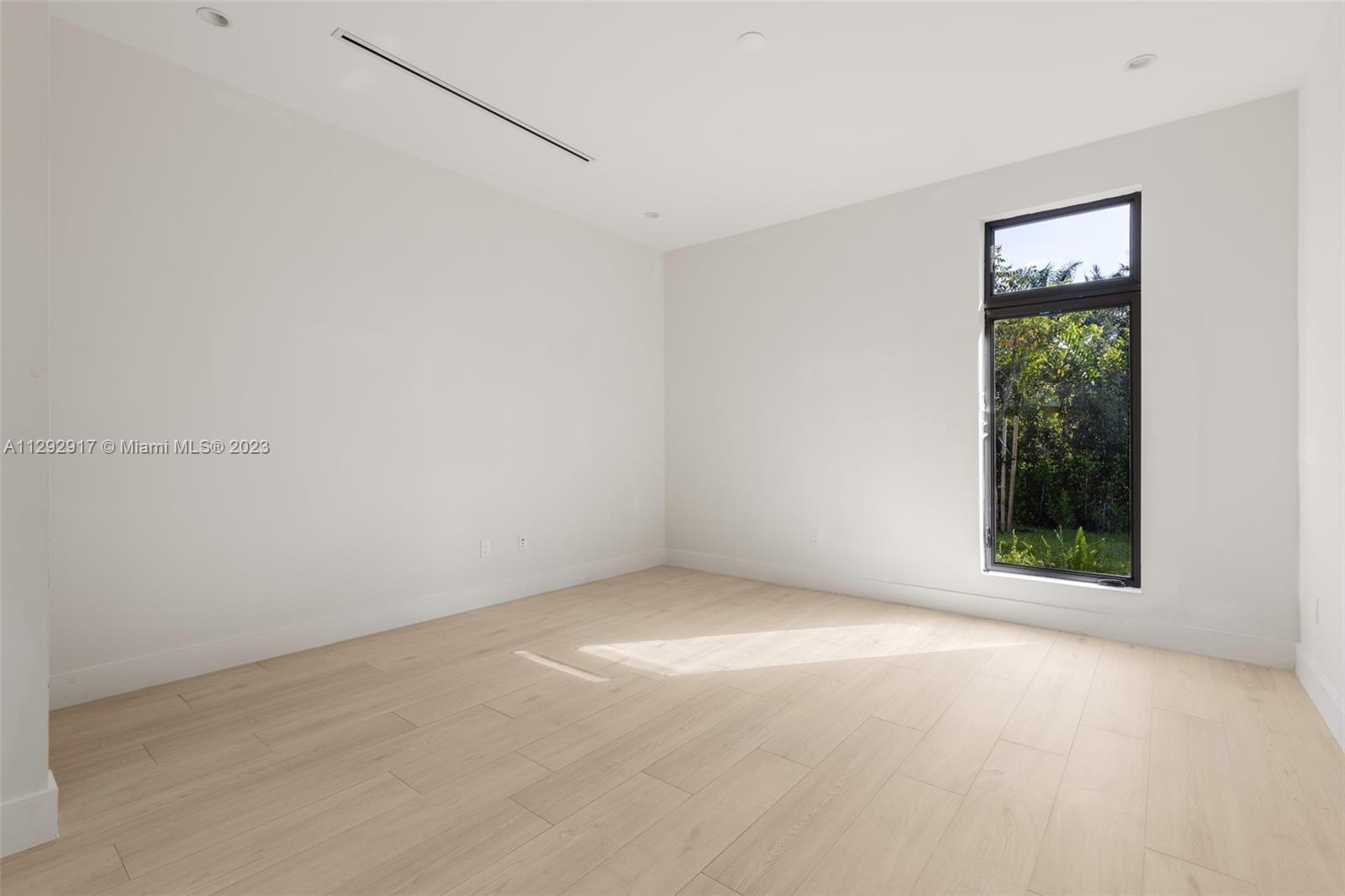 491 Ranch Road Weston, FL 33326 - Photo 29 of 46 an empty room with a window