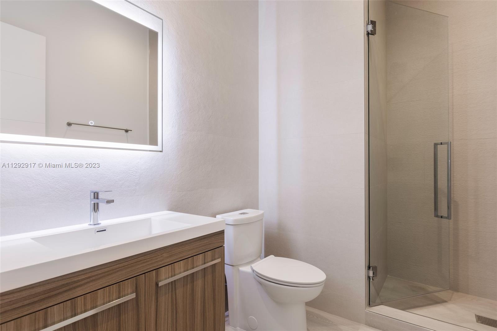 491 Ranch Road Weston, FL 33326 - Photo 33 of 46 a bathroom with a sink a toilet and shower