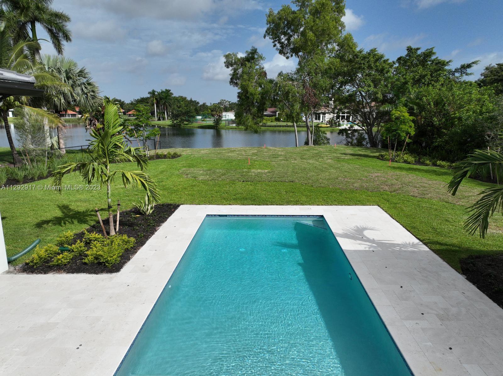 491 Ranch Road Weston, FL 33326 - Photo 36 of 46 a view of a garden with lake