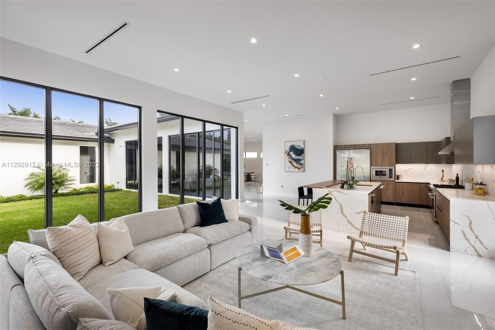 491 Ranch Road Weston, FL 33326 - Photo 6 of 46 a living room with furniture and a large window