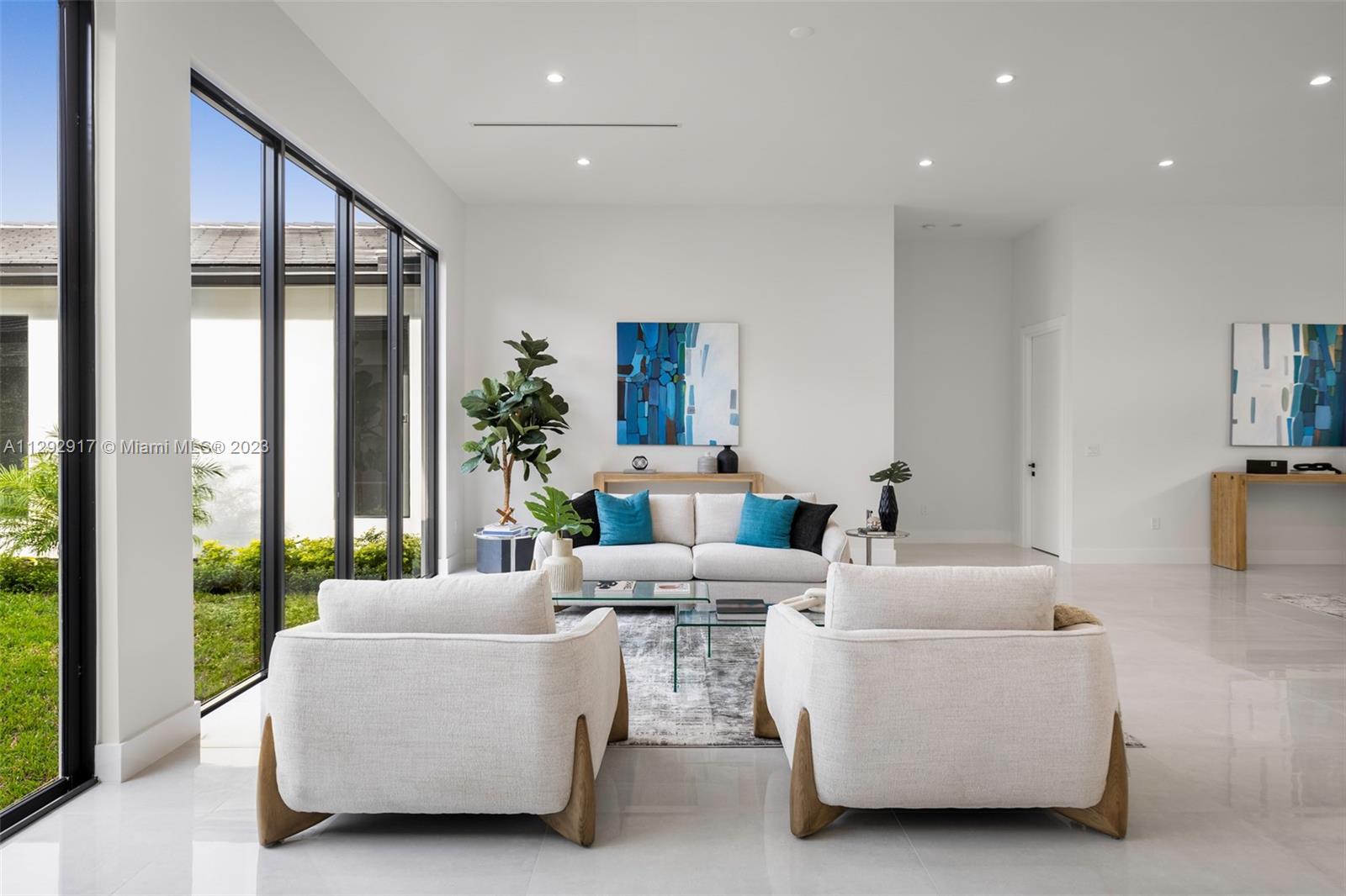 491 Ranch Road Weston, FL 33326 - Photo 9 of 46 a living room with furniture and a large window