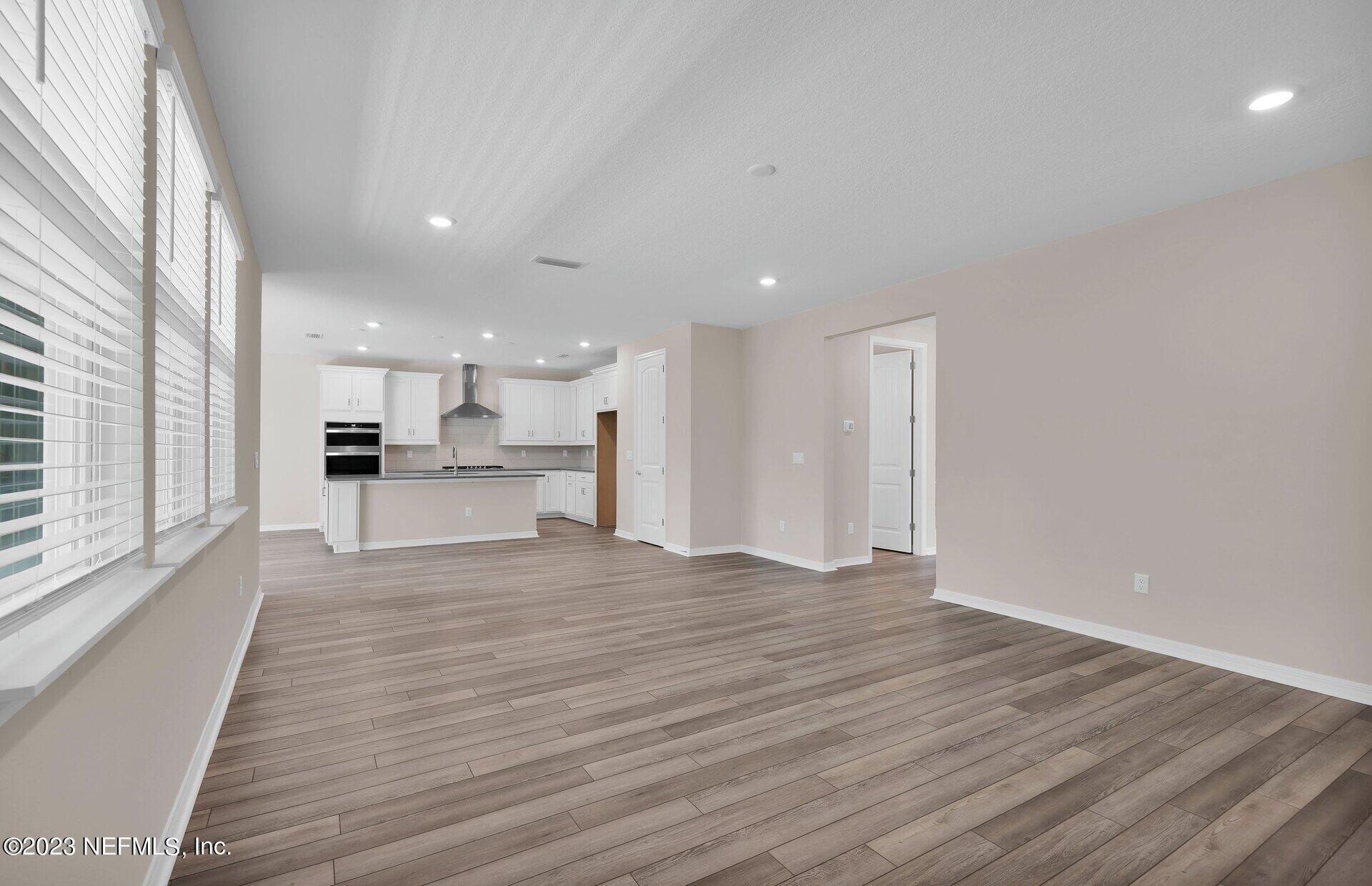 338 Red Barn Road St. Augustine, FL 32092 - Photo 13 of 34 a view of kitchen with wooden floor