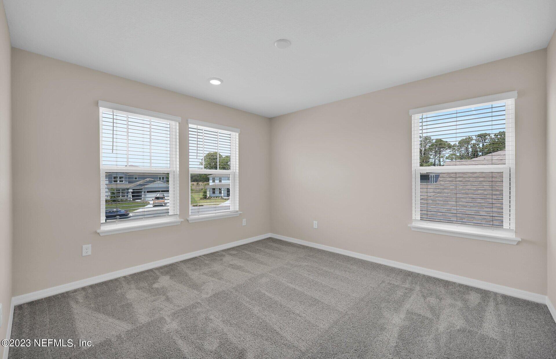 338 Red Barn Road St. Augustine, FL 32092 - Photo 19 of 34 a view of an empty room with a window