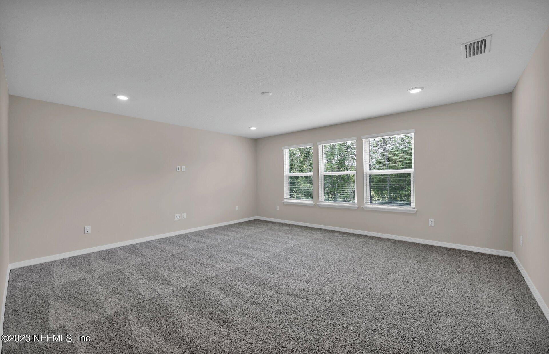 338 Red Barn Road St. Augustine, FL 32092 - Photo 23 of 34 a view of an empty room with a window