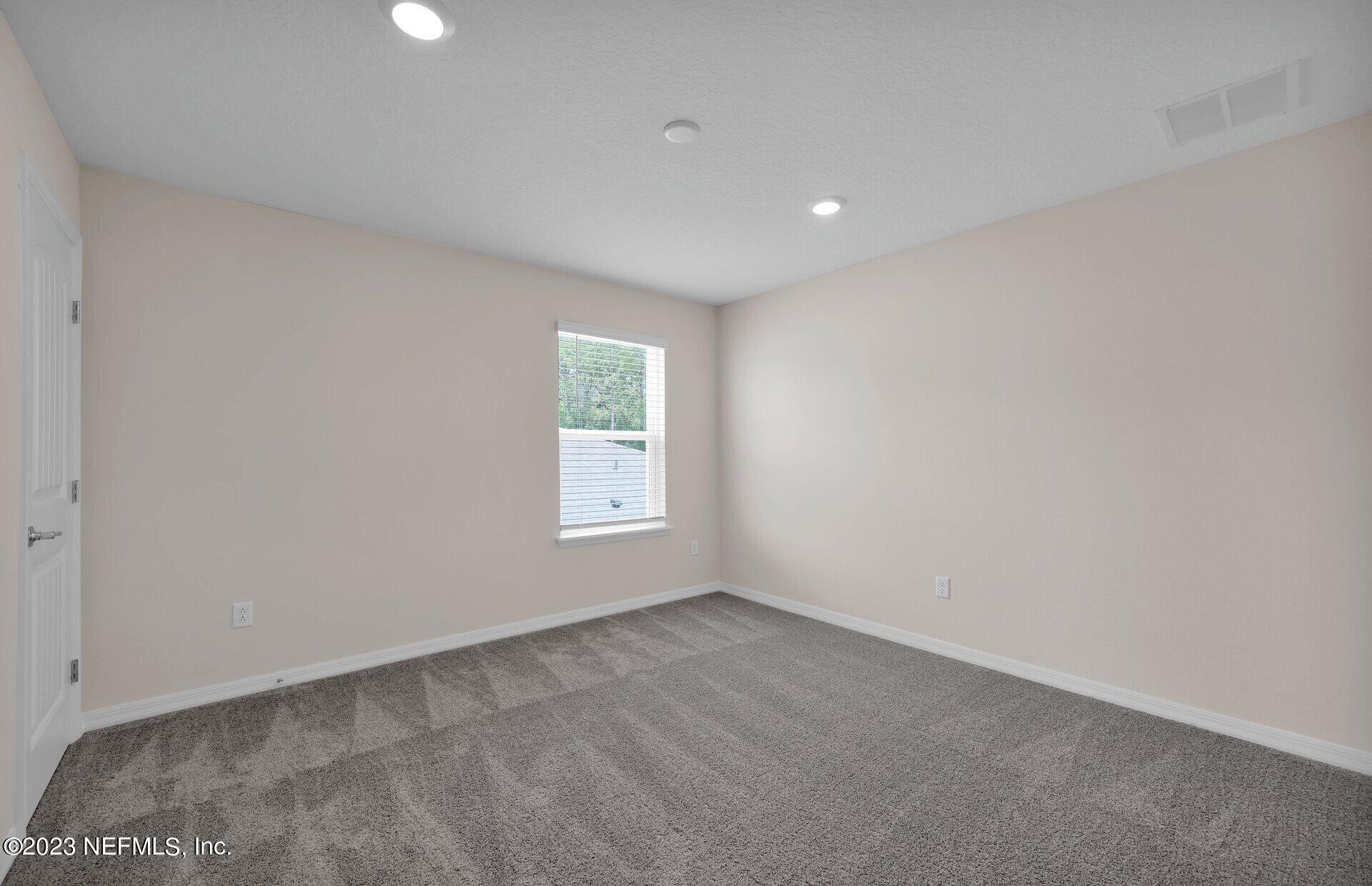 338 Red Barn Road St. Augustine, FL 32092 - Photo 25 of 34 an empty room with a window