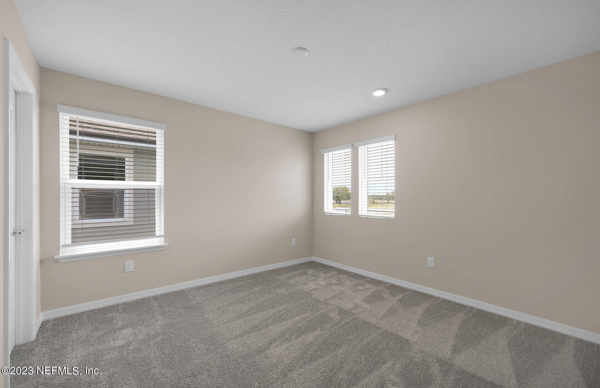 338 Red Barn Road St. Augustine, FL 32092 - Photo 28 of 34 a view of an empty room with a window