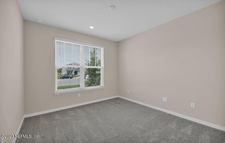 338 Red Barn Road St. Augustine, FL 32092 - Photo 6 of 34 an empty room with a window